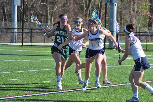 THE girls’ lacrosse team’s defense enabled the Pioneers to pound North Reading 13-3 April 14. (Mark Grant Photo)