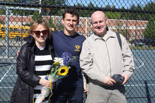 SENIOR CAPTAIN Danny Bronshvayg presented flowers to his parents Yelena and Michael during a Senior Day ceremony held prior to the Pioneers’ 3-2 victory over North Reading May 18. Bronshvayg won his second singles match in two sets. (Dan Tomasello Photo)