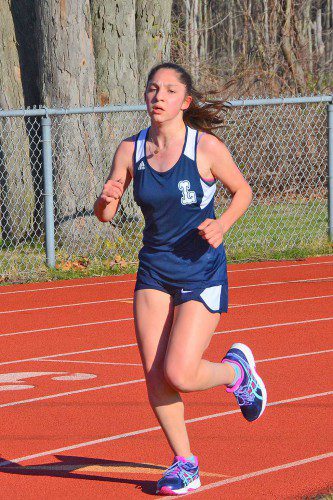 DOUBLING UP. Cristina Kinslieh competed in both the half mile (3:05) and the mile (6:34) in her team's tri-meet against Hamilton-Wenham and Newburyport. (John Friberg Photo)
