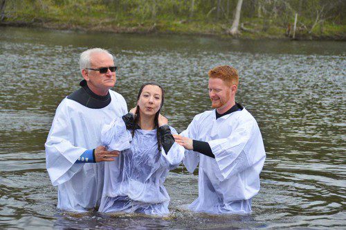 JENNIE O'BRIEN as the first of 14 candidates baptized in the Ipswich River on Sunday on the occasion of Trinity Evangelical Church's 200th anniversary. (Bob Turosz Photo)