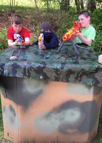 READY. AIM. FIRE. From left, Drew Von Jako, Colin McCormack and Kevin Connolly are prepared to test their battle-readiness in the Nerf Battle Zone, a new event offered at Townscape’s Kids Day on Saturday. A Nerf Mega Elite Centurion Blaster, like the one Connolly is holding, will be raffled off to benefit Townscape. (Courtesy Photo)