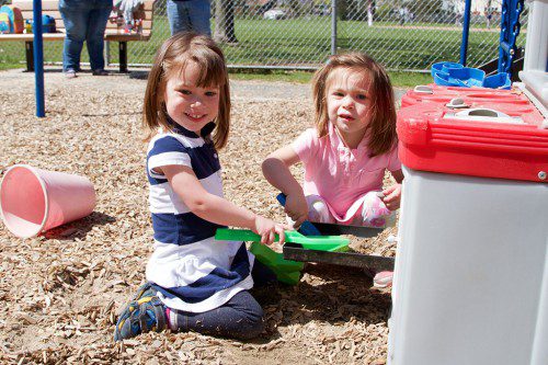 THE NEWER PLAY AREA at Moulton Park holds the interest of identical twins Zoe and Leah Joffe, who will be 3 in June. (Donna Larsson Photo)