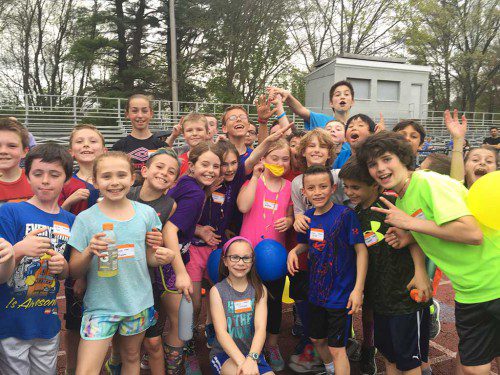 HAPPY CAMPERS. Boys and girls participating in the free track and field camp had a great time learning the basics of the sport from current high school Pioneer athletes and coaches. (Courtesy Photo)