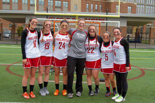 THE MELROSE girl's varsity lacrosse team had reason to celebrate on Senior Night: a 16-1 win over Stoneham. Pictured (from left) are seniors Katie Baraw, Haley Mate, Hayley Rodriguez, Sarah Foote, Mia Crancazio, Michelle Henry and Annie McFarland. (Donna Larsson photo)