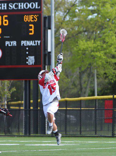 CALVIN WHITE is airborne for the Melrose boy's lacrosse team who took an easy win over Watertown on Tuesday, 19-8. (Donna Larsson photo)