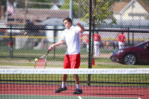 THE MELROSE Red Raider tennis team remains undefeated at 6-0 in the ML Freedom League after a victory over Wilmington on Monday. Pictured in second singles is Jack Mays. (Donna Larsson photo) 
