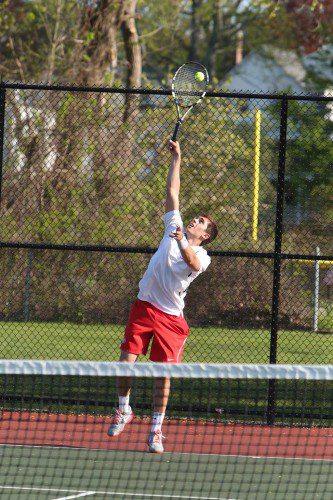 LEAGUE WINNERS. The Melrose Red Raider tennis team earned their third straight league title after a 4-1 win over Burlington. Pictured is Julian Nyland in first singles. (Donna Larsson photo)