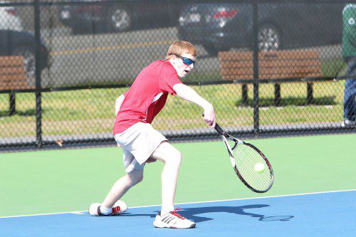 JAMES HANRON, a junior, played a hard fought match at first singles on Thursday night against Melrose’s Julian Nyland at the Dobbins Courts. (Donna Larsson File Photo)