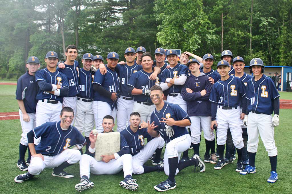 SOAKED to the bone, yet elated over their walk-off 6-5 victory over Pentucket, the Pioneer baseball team celebrates its advancement to the quarterfinal round of the Div. 3 North tourney Sunday. (Maureen Doherty Photo)