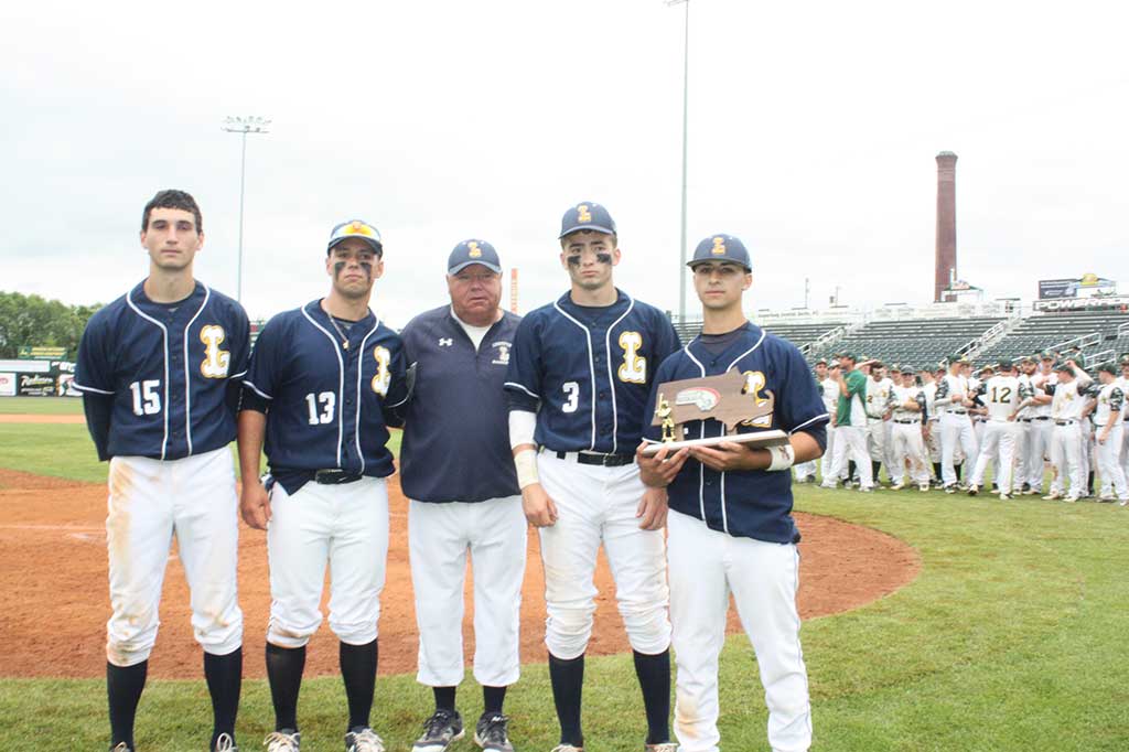 PIONEER CAPTAINS and their coach accepted the Division 3 North finalist trophy after the team's 5-1 loss to North Reading in the sectional championship. The Pioneers went 3-1 in the tournament series to finish 19-5 overall. From left: senior captains Nick Colucci and Spencer Balian, Coach John O'Brien, senior captain Dan O'Leary and junior captain Justin Juliano. (Maureen Doherty Photo)
