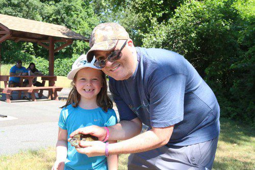 FATHER–DAUGHTER PARTNERSHIP. Olivia Antonuccio, 6, showed her dad Peter how to catch the big ones at the Martins Pond Fishing Derby. (Lori Lynes Photo)