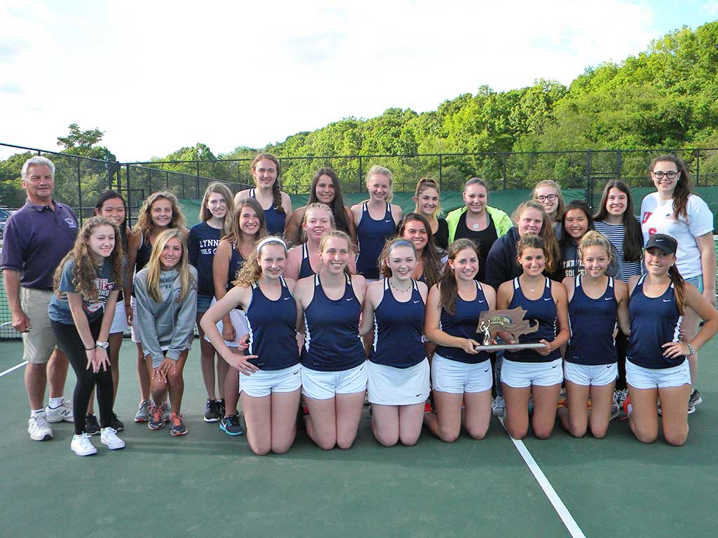 THE GIRLS’ TENNIS TEAM proudly displays its third straight Division 3 North championship trophy following the Pioneers’ 3-2 victory over Manchester-Essex June 10. Kneeling, from left, Katie Nugent, Hayley Timmons, Katie Nevils, Amanda Stelman, Olivia Skelley, Camie Foley and Sarah Mezini. Second row, from left, Rebecca Albanese, Ally D’Amico, Makayla Maffeo, Laura Mucci, Rachel Strout, Jenna Robbins and Daphne Terris. Third row, from left, head coach Craig Stone, Jocelyn Wang, Alexa Vittiglio, Amanda Motzkin, Allison Carey, Mariana Theophiles, Nicole Davie, Rachel Collins, Christina Albano, Bria Parziale, Danielle Douglas and Nina Dunn. (Dan Tomasello Photo)