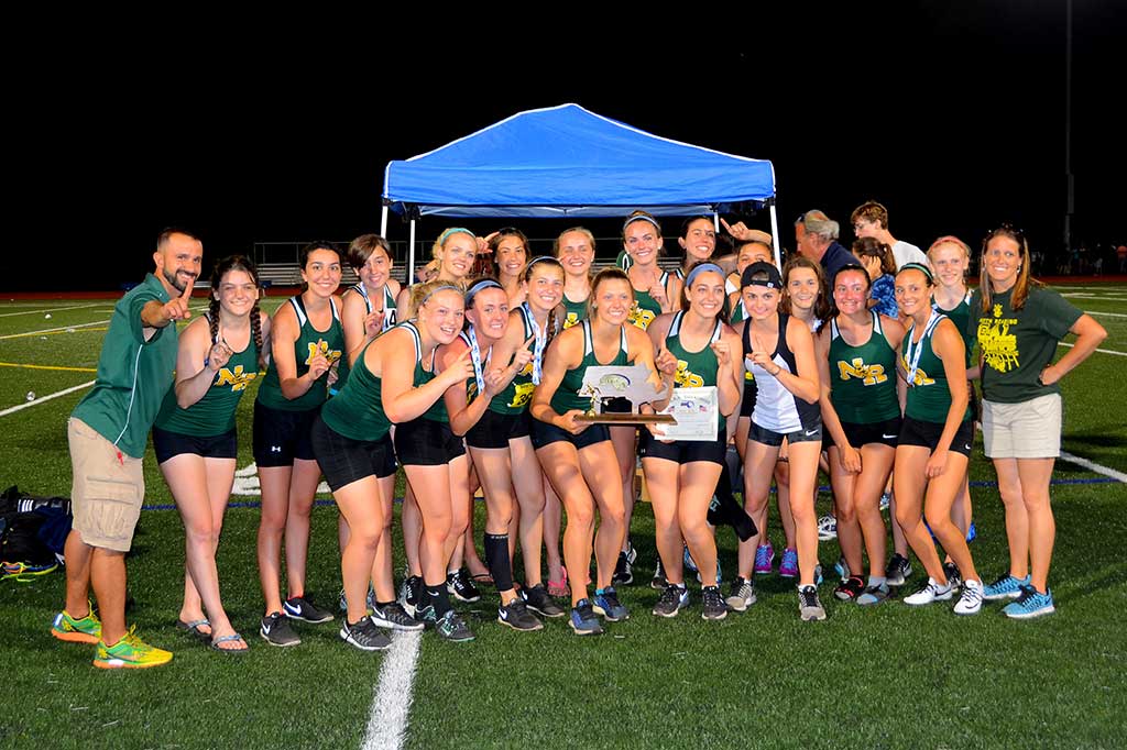 THE NRHS GIRLS' TRACK TEAM celebrates its Division 4 state championship in Norwell. At left is head coach Sotirios Pintzopoulos. (John Friberg Photo)