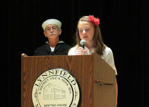 LMS FIFTH-GRADER Hannah Gromko addresses the crowd during Memorial Day services as Veterans’ Services Officer Bruce Siegel looks on. (Marie Lagman Photo)