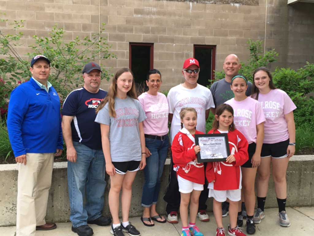 THE MELROSE Youth Hockey Girls program was presented the USA Hockey Female Honors Award for 2016. Pictured are (l to r) Mark Lissner, USA Hockey; Peter Giuliano, MA Hockey; representing MYH Sofia Gukelberger, Melissa Aveni, Frank Sorrenti, Mike O’Connor, Rachel Aveni, Courtney O’Connor, Julia McNeely and Kate Doucette. (courtesy photo) 