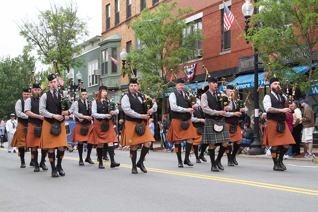 MARCHING DOWN Main Street during Sunday’s annual Memorial Day Parade are the music makers in Kevin Barry Pipes and Drum. (Donna Larsson Photo) 
