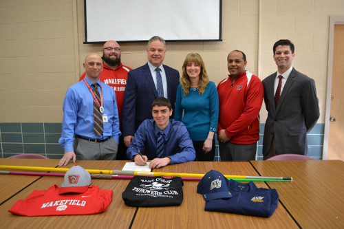 KEVIN RUSSO (sitting) signed his letter of intent to attend Merrimack College. In attendance at the signing (from left to right) are WMHS Principal Richard Metropolis, Assistant Coach Justin Berry, parents Mark Russo and Elizabeth Russo, Head Coach Ruben Reinoso and K-12 Director of Athletes, Health, Wellness for the Wakefield Public Schools Brendan Kent.