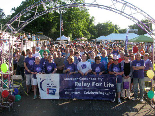 CANCER SURVIVORS and their caregivers get ready to walk the “Survivors’ Victory Lap” at Friday’s Wakefield Relay For Life held at Northeast Metro Tech High School. (Mark Sardella Photo)
