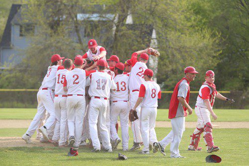 THE WMHS baseball team celebrated after capturing its second straight Middlesex League Freedom division championship. The Warriors are hoping to celebrate a state tournament win after today's first round game against Lynn Classical. (Donna Larsson File Photo)