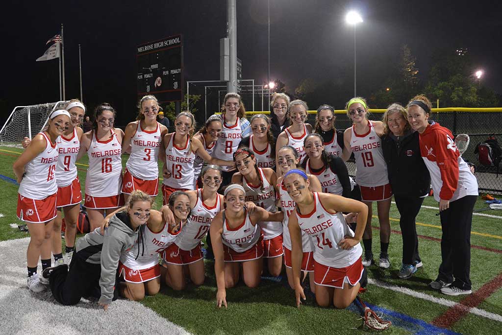THE MELROSE girls' lacrosse team upset #2 Manchester-Essex on June 4 prior to competing in Tuesday's season-ending game against Ipswich. They are pictured here celebrating a playoff win. (courtesy photo, Doug Baraw) 