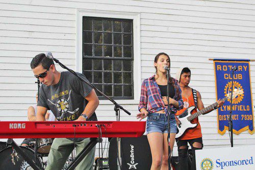 MENTORED by musician Brian Maes, the band 43 Church Street impressed their audience at last week’s Rotary concert. From left: keyboardist Erik D’Orlands, vocalist Rachele DiFava and bass guitar player Ben Lyon were accompanied by the Brian Maes Band on rock classics like “Jailhouse Rock.” (Maureen Doherty Photo)
