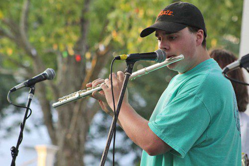THROWBACK rock. Flutist Joe Winslow demonstrated his talents as both a soloist and collaborative performer with the Brian Maes Band at last week’s Rotary Club concert on the common. He is a student of Brian Maes. (Maureen Doherty Photo)