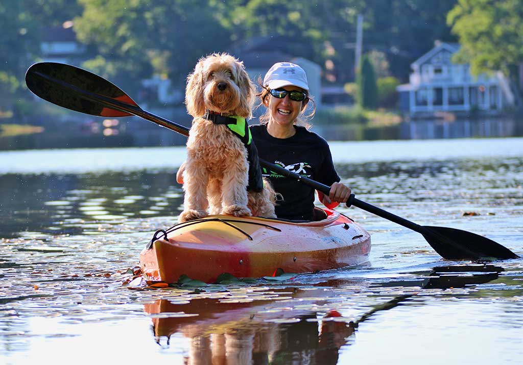 JOYCE DAVIS paddles her kayak while her friend Brady navigates on a beautiful, sunny summer afternoon on Martins Pond. (Lori Lynes Photo)