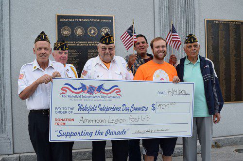 WAKEFIELD'S CORPORAL HARRY E. NELSON American Legion Post #63 presented a $500 donation on Flag Day to Wakefield Independence Day Committee Chairman Patrick Sullivan in front of the World War II Memorial. 