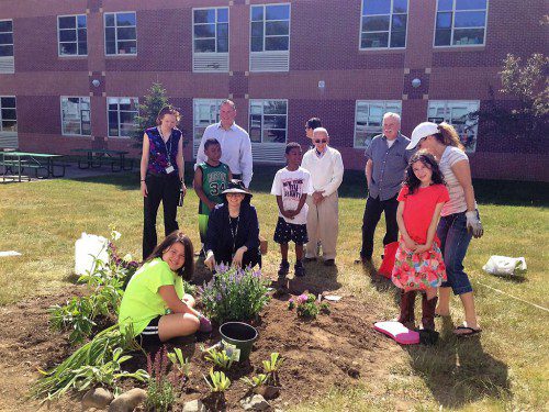 WAKEFIELD ADULT MENTORS-Big Brothers/Sisters maintain the Dolbeare School Friendship Garden.