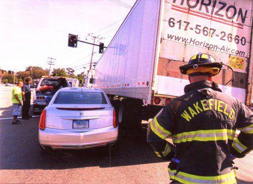 TRAFFIC was snarled Saturday afternoon, Aug. 27, at the 3-way intersection at the end of the Salem Street exit off Rte. 128 when the driver of a tractor-trailer truck apparently swerved to the right, nearly going onto the sidewalk to avoid a collision with the driver of a silver sedan registered in Connecticut. (Don Young Photos)