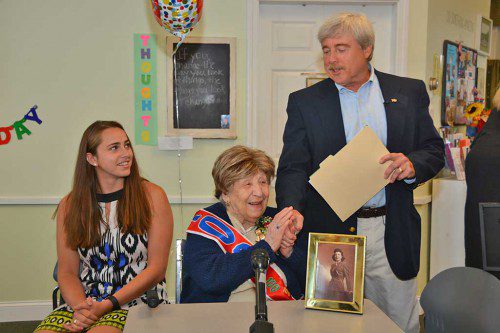 A DAY FOR CLARE. Selectman Stephen O'Leary brought congratulations from the town on the occasion of Clare Picciuto's 100th Birthday. The Selectmen declared her birthday "Clare Picciuto Day in North Reading. Seated at the left is Clare's granddaughter, Elisabeth Watson. (Bob Turosz Photo)