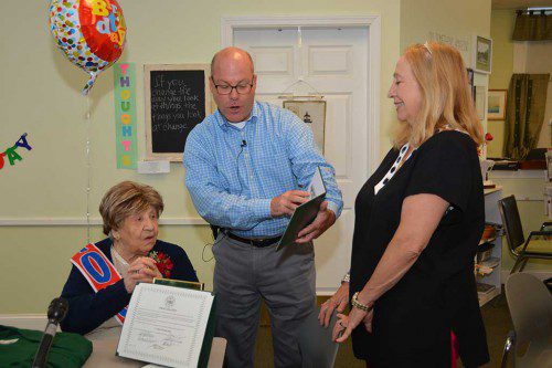 NORTH READING'S NEWEST GRADUATE. Superintendent of Schools Jon Bernard presents a North Reading High School diploma to Clare Picciuto on her 100th birthday. Standing at right is her daughter Deb Picciuto. (Bob Turosz Photo)