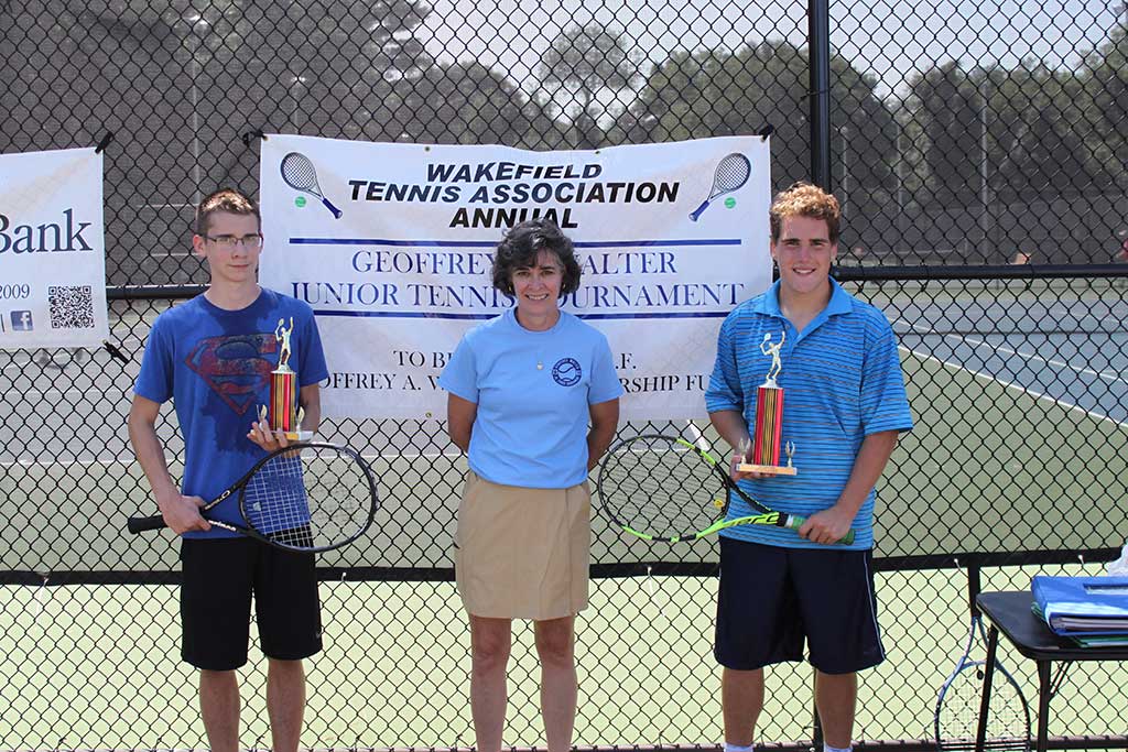 TROPHIES FOR the High School Boys’ Division were presented at the end of the Geoffrey Walter Jr. Tennis Tournament. From left to right are HS Boys’ finalist Zach Covelle, Tournament Director Jennifer Walter and HS Boys’ Champion Colin Lamusta.