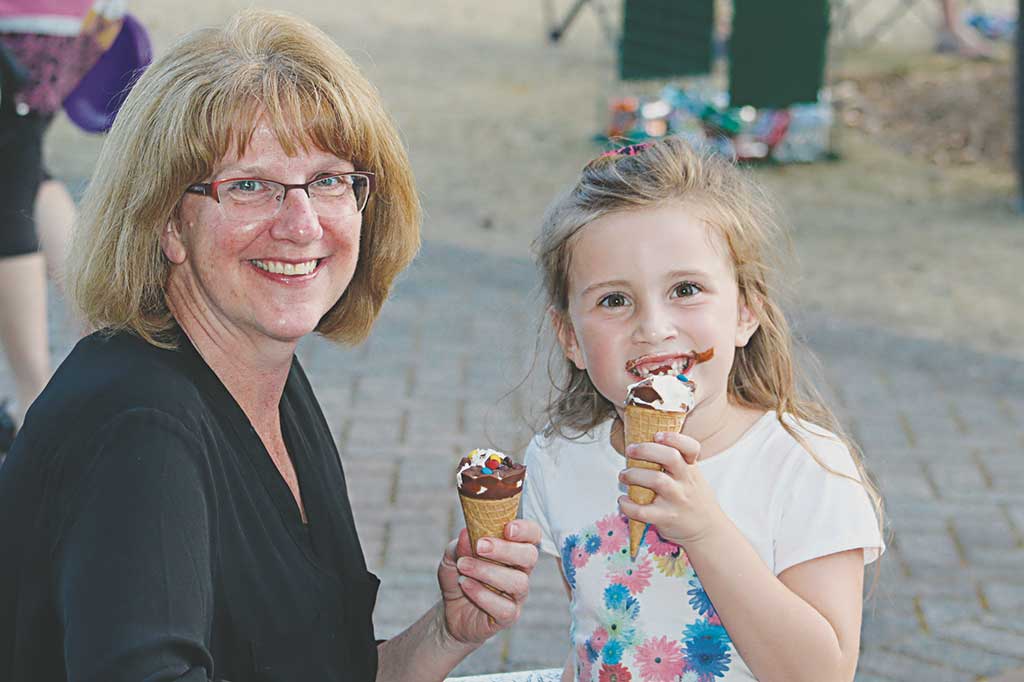 THERE'S nothing like sharing a cool ice cream on a hot summer night with someone special. Enjoying their treat together at Ipswich River Park are Terri Cappucci and her granddaughter Alaina Foss, 6. (Maureen Doherty Photo)