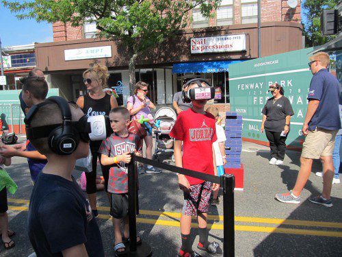 AT FESTIVAL ITALIA, held Saturday, Aug. 20, kids who love the Red Sox got to experience game day at Fenway Park by donning virtual reality gear. (Gail Lowe Photo)