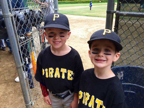 T–BALL PLAYERS Aaron DuPriest and Tommy Fagner make ready to take the field for their last game of the season with the Pirates. (Nancy Boudreau Photo)