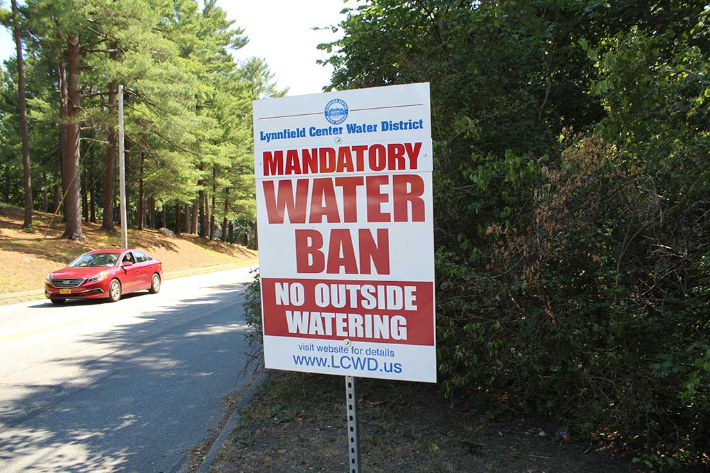THE MANDATORY ban on outside watering has entered its seventh week within the Lynnfield Center Water District (LCWD) due to the extended drought. Only hand-held watering is allowed and fines will be imposed on those caught using sprinklers or irrigation systems. The state DEP enacted the ban in June for all communities that withdraw water from the Ipswich River basin. Those unsure of the water district in which they reside need only check the color of the fire hydrants in their neighborhood. LCWD hydrants are green. (Maureen Doherty Photo)