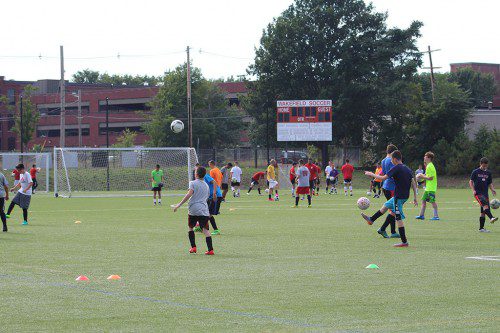 THE WMHS boys' soccer team begin the preseason yesterday afternoon at Walton Field with the first day of practice. Several players perform ball-handling drills during the practice. (Keith Curtis Photo)