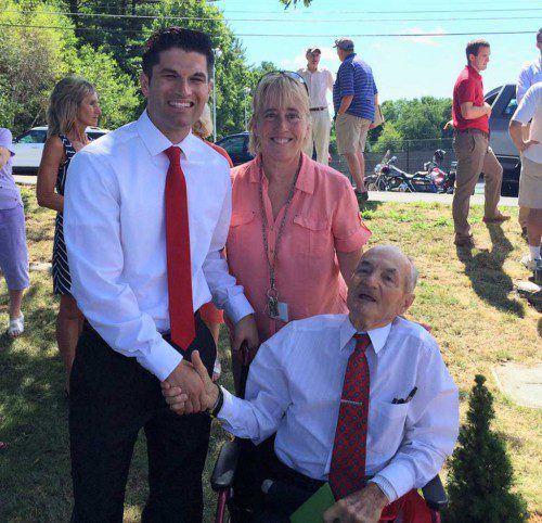 LEGENDARY WMHS CROSS COUNTRY COACH John A. DiComandrea at yesterday’s dedication of a granite marker at the Shaun Beasley Track & Field complex at Wakefield Memorial High School. With Coach “Deke” are Director of Athletics Health and Wellness Brendan Kent and School Superintendent Kim Smith.