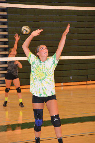 SOPHOMORE BROOKE DEGRANDE practices with the varsity volleyball team in the high school gymnasium last week. (Bob Turosz Photo) 