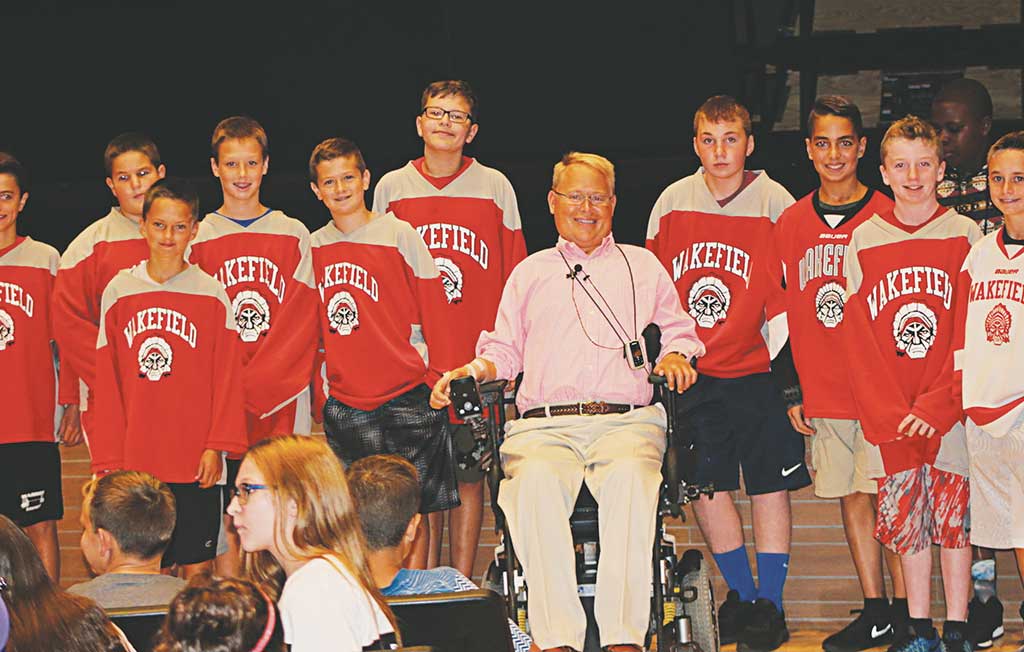 TRAVIS ROY, the the Boston University hockey play who suffered a paralyzing injury in his first game for BU, spoke to students, including youth hockey players, at the Galvin Middle School yesterday. He spoke to kids about meeting life's challenges, whether we choose them or they choose us. (Keith Curtis Photo)