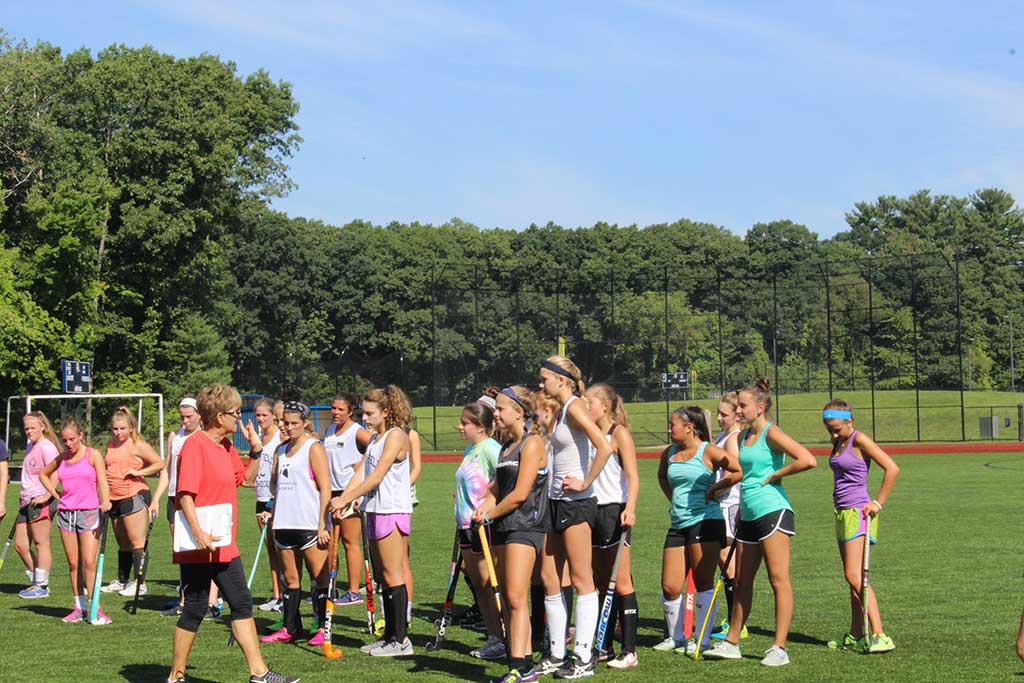 HEAD field hockey coach Mamie Reardon (at left) explains to her players how to proceed through six footwork development stations at preseason practice. The team’s season opener is Thursday at home against Triton.(Maureen Doherty Photo)
