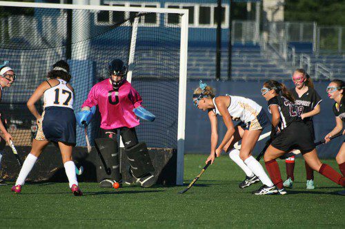 FRESHMAN Carolyn Garofoli (to right of goalpost in white) scored the fifth goal in Lynnfield's 7-0 shutout over Rockport at home last Thursday. (Maria Terris Photo)