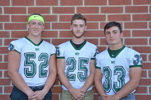 TRI–CAPTAINS will lead the football varsity for this year's campaign. From left: Bob O'Donnell, Matt McCarthy and John Merullo. (Bob Turosz Photo)