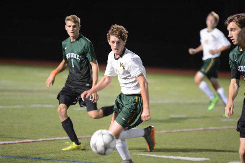 THE SOCCER BALL is heading out of bounds, but sophomore Kevin Wall is in hot pursuit for the Hornets. (Bob Turosz Photo)