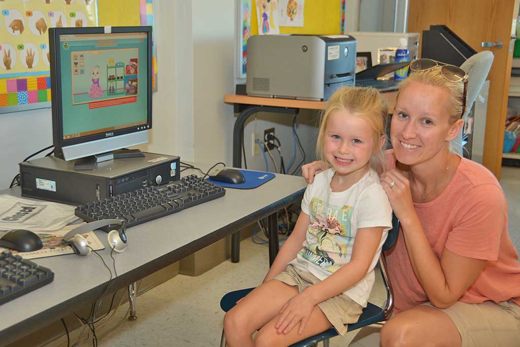 FOUR–YEAR–OLD Makenna Grimbilas came to the Batchelder School last week to help her mother Sara, a kindergarten teacher, get her classroom ready for the first day of school on Sept. 7. (Bob Turosz Photo)