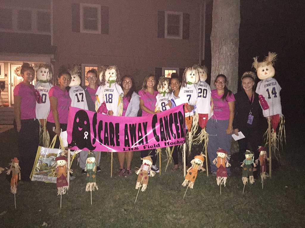 BOO! Senior field hockey players launched their first “Scare Away Cancer” visit by “spooking” a local lawn with a team of scarecrows. Beware, you could be next! From left: Kathleen Hamm, Lilli Patterson, Isabella Floramo, Rachel Strout, Marianne Oliveri, Jaylin Grabau, Danielle Douglas and Elise Murphy. Missing from photo: Ava Figucia and Jillian Zahar. (Courtesy Photo)