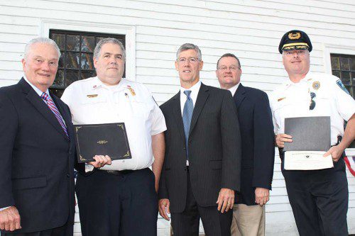 THE TOWN recognized its first responders during the Rotary Club’s inaugural First Responders Day Sept. 13, which included presenting citations and proclamations to the fire and police departments. From left, Selectman Dick Dalton, Fire Chief Mark Tetreault, Under Secretary for Homeland Security Patrick McMurray, State Rep. Brad Jones and Police Chief David Breen. (Dan Tomasello Photo)
