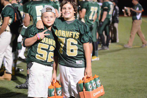 WATERBOYS Jack O’Donnell, (left), and Owen Delano give the football Hornets an edge whenever they take on their opponents. They boys wear the jerseys of their big brothers, Bob O’Donnell and Drew Delano, who play for the varsity. (Bob Turosz Photo)