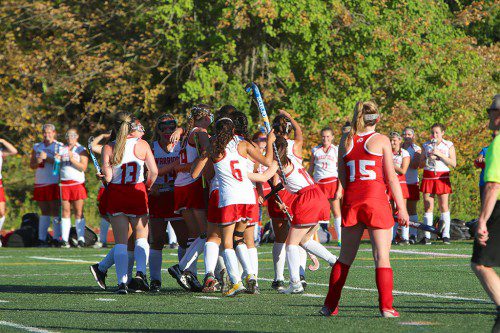 THE WMHS field hockey team celebrates after scoring the tying goal with no time left as it played Melrose to a 4-4 draw yesterday afternoon at Shaun Beasley Field. (Donna Larsson Photo)